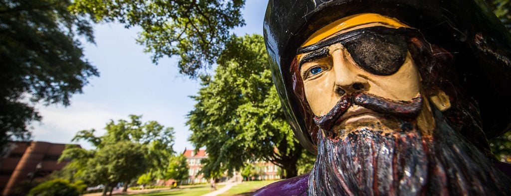 Closeup of the face of the ECU pirate statue.